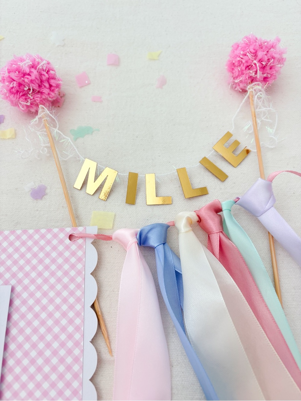 Personalized Gold 'Millie' Party Banner with Pink Pom-Poms and Pastel Ribbons